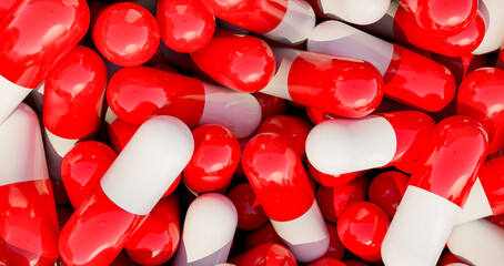Red medical pills, capsules in a box. Industrial production of medicine, antibiotica or other drugs.