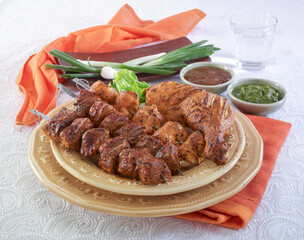 Mix barbecue platter including beef boti, Bihari boti, chicken boti and chicken tikka
