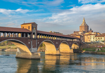 Ponte Coperto or covered bridge over Ticino river in Pavia, Lombardy, italy.. - obrazy, fototapety, plakaty