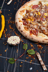 Barbecue pulled pork pizza with cheese, pepper and sauce close-up on the table. horizontal