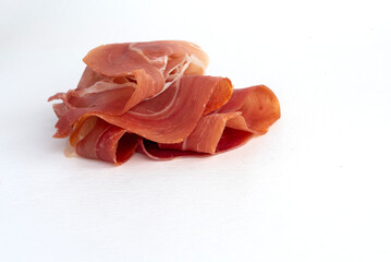 Slices of delicious dry-cured pork meat. Jamon, Parma, Ham on isolated white background
