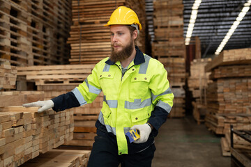 Caucasian businessman checking and use precision level to wood timber at warehouse  - 763416563