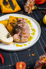 Toasts with Duck pate Rillettes de Canard on wooden board. Dark wooden background. Top View