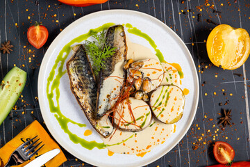 baked mackerel fish in a pan with lemon herbs and spices, banner, menu recipe place for text, top view,