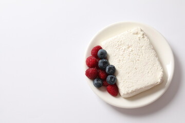 Сottage cheese with berries in a plate