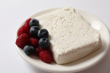 Сottage cheese with berries in a plate