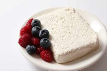 Сottage cheese with berries in a plate