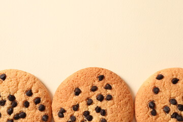 Cookies with chocolates on a colored background
