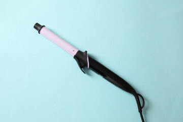 hair curler on a colored background