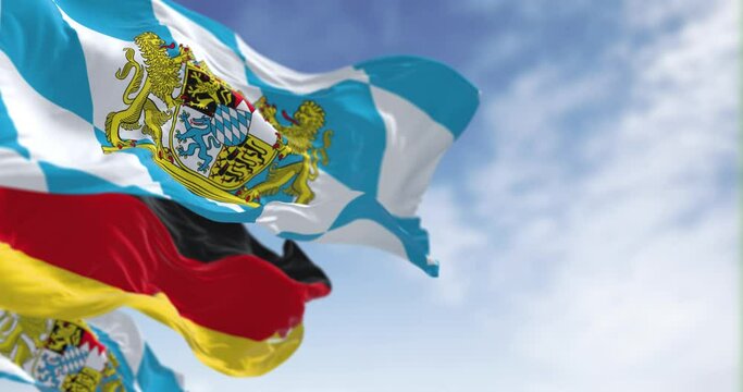 Bavarian flags waving with national german flag on a clear day