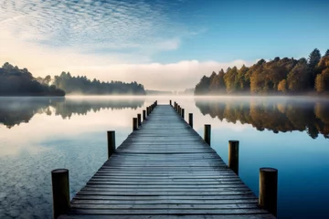  Tranquil lake scene with a wooden jetty stretching into the water © KerXing