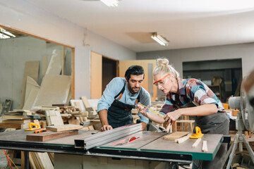 In a carpenter's shop, a skilled man with training in the craft uses tools to perform woodwork, blending occupation, industry, and business.