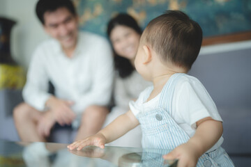 Portrait of enjoy happy love family asian mother playing with adorable little asian baby newborn...