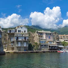 Fototapeta na wymiar Corsica, Erbalunga, typical houses in the harbor in summer 