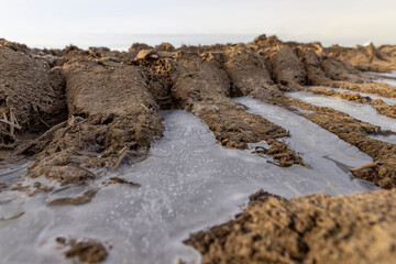 a deep track from a heavy car in a field