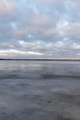 a large lake in winter in the morning during sunrise