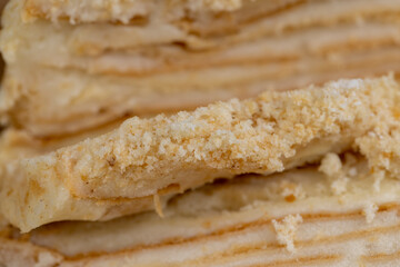 multi-layered cake made of buttercream and thin wheat cakes