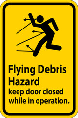 Warning sign indicating the risk of flying debris, advising to keep the door closed.