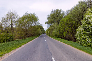 windy cloudy weather and highway in rural areas