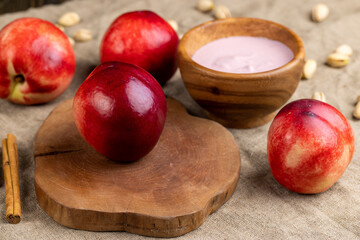 Obraz premium preparation of nectarine yogurt using fresh ripe nectarines