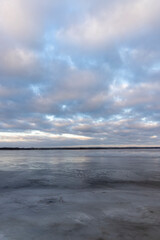 a large lake in winter in the morning during sunrise