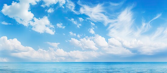 A boat sailing in the ocean under cloudy skies