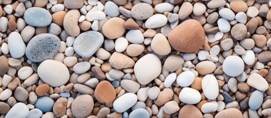 A pile of rocks and gravel on a beach up close