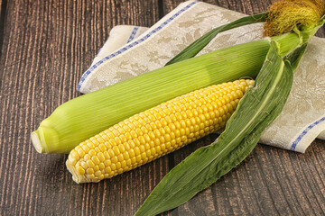 Yellow sweet raw cob corn