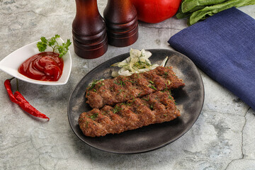 Kebab with beef served onion