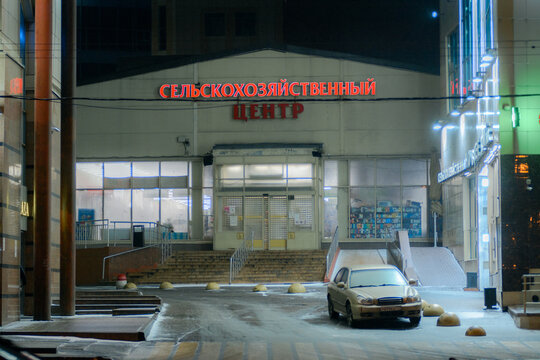 Car near market in Moscow during freezing rain