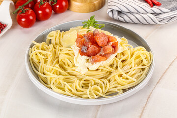 Pasta spaghetti with salmon and stracciatella