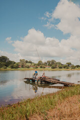 Fototapeta na wymiar people fishing at the lake