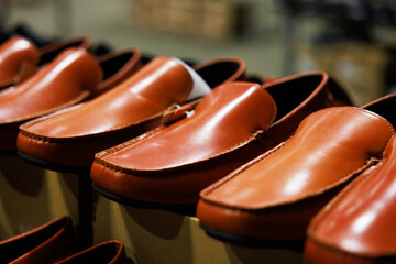Leather shoes were lined up on the store shelves. Men elegant shoes in a man clothing boutique....