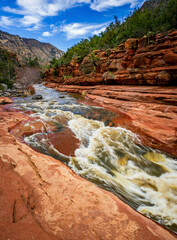 Oak Creek flows over red sandstone at Slide Rock State Park near Sedona Arizona - 763485991