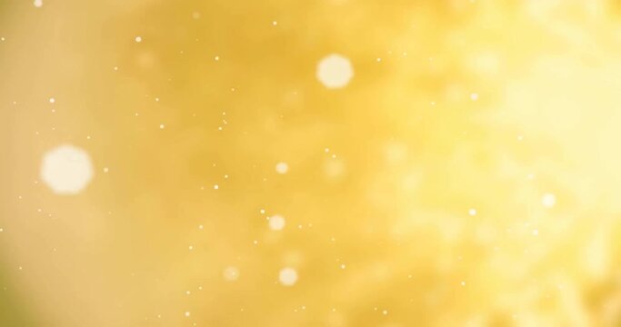 Animation of glowing spots of light moving on yellow background