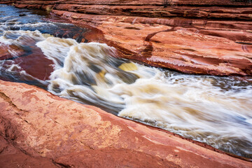 Oak Creek rushes over red sandstone at Slide Rock State Park near Sedona Arizona - 763486762