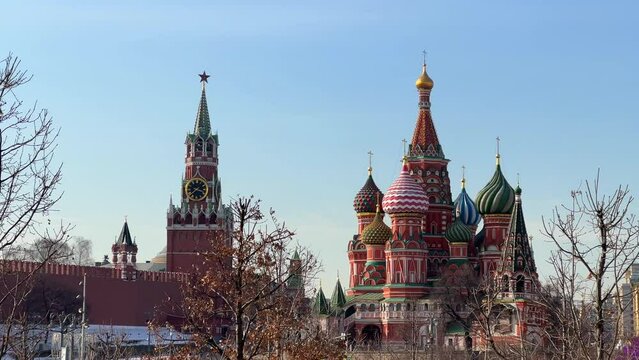 Moscow Kremlin clock tower and St. Basil Cathedral on Red Square