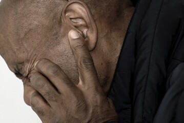 deaf man suffering from deafness and hearing loss on gray background with people stock image stock...