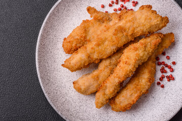 Delicious fresh chicken or turkey strips or nuggets breaded with salt and spices