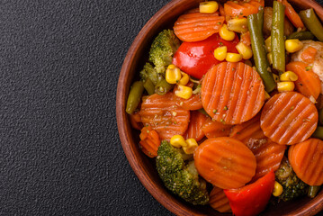 Delicious healthy vegetables steamed carrots, broccoli, asparagus beans and peppers