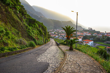 Coastal route ER101 on the north coast of Madeira island (Portugal) leading down to the village of...
