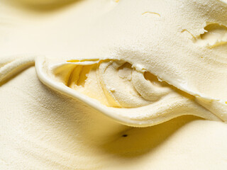 Vanila flavour gelato - full frame detail. Close up of a beige surface texture of vanilla Ice cream.