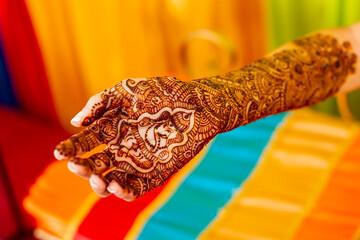 Henna tattoo of Ganesha on bride hand