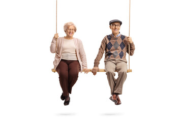 Male and female pensioners sitting on a big wooden swing