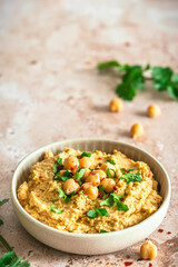 Hummus, chickpea puree with coriander in a bowl