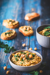 Hummus, chickpea puree with coriander in a bowl