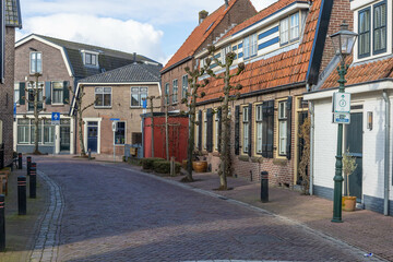 street iSpakenburg, the Netherlands. 25 February 2024. A street with typical houses in Spakenburg....