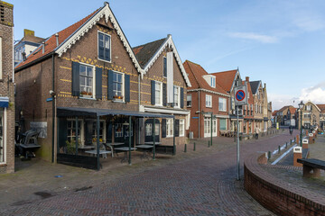 Spakenburg, the Netherlands. 25 February 2024. A street with typical houses in Spakenburg. The village has several harbors