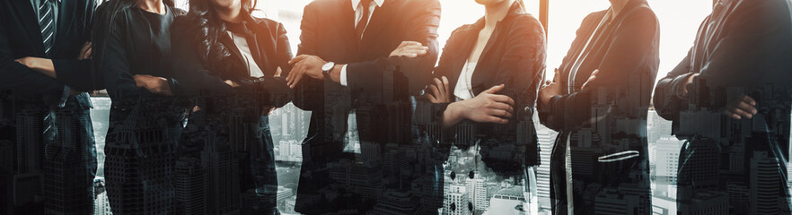 Business people group standing together with city office building background double exposure....