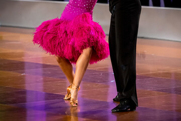 a couple dance a Latin dance. the legs of a dancing couple